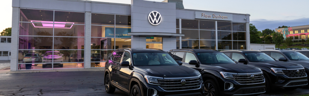 Volkswagen of Durham dealer with several VW SUVs parked out front